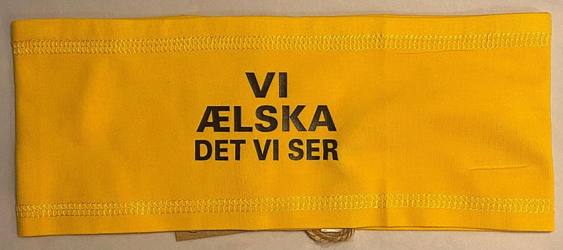 Pannebånd gul m/tekst